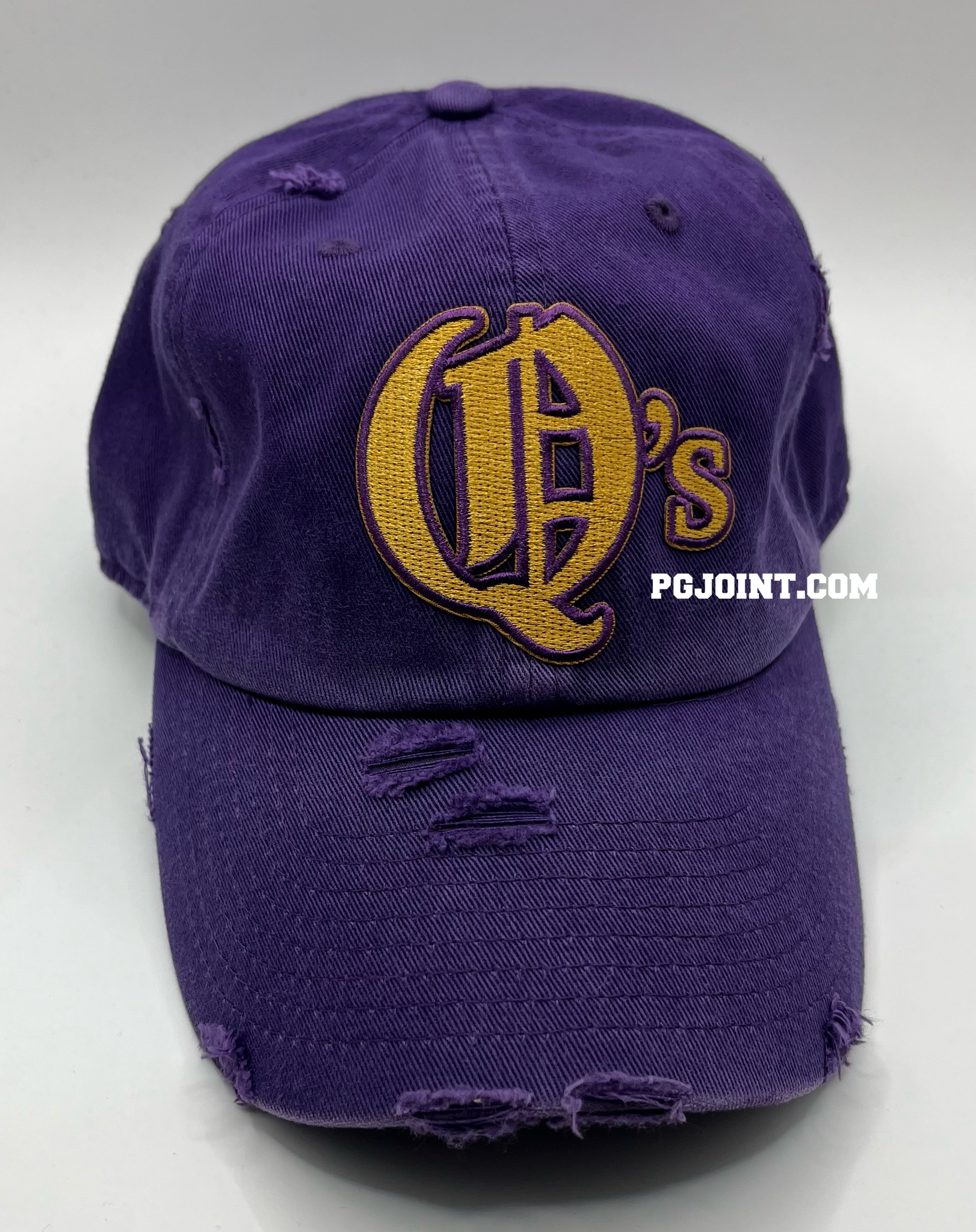 Q’s embroidered hat